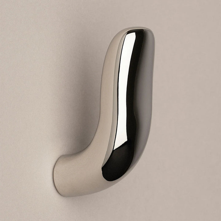 Softly curved J shaped hook in polished nickel, side view.