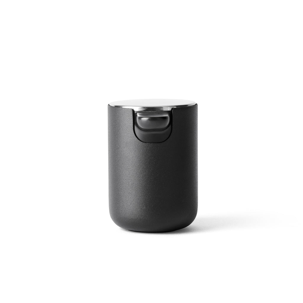 Made of stainless and  powder coated steel, this modern soap dispenser is designed by Menu.