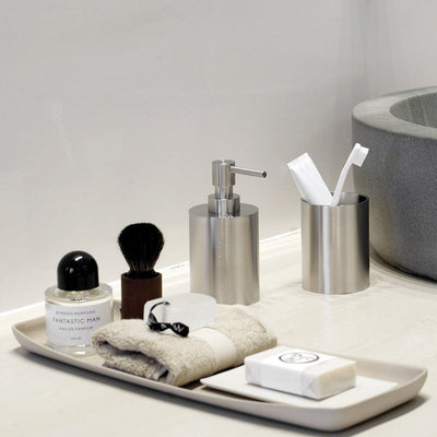 a bathroom counter with the ONE by Piet Boon Toothbrush Holder, Formani soap dispenser.
