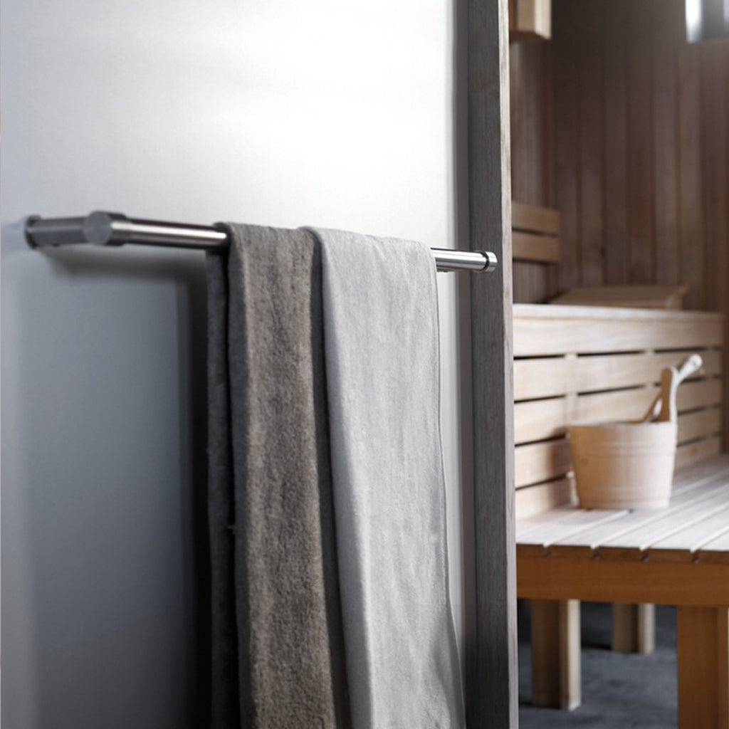 A ONE by Piet Boon Towel Bar from Formani hanging on the side of a door.