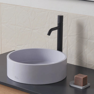 An Odet Basin SM by mudd. concrete sitting on top of a counter.