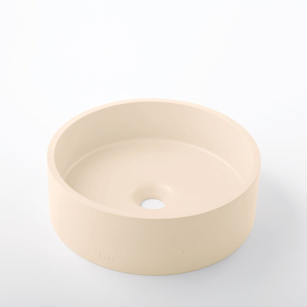 A mudd. concrete Odet Basin SM sink on a white surface.