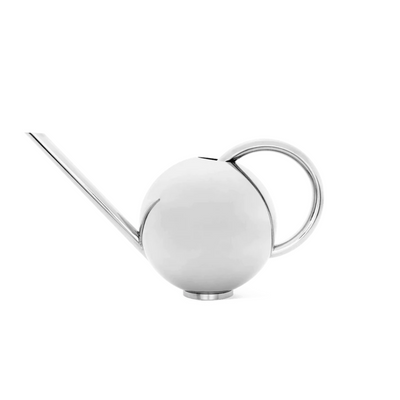 A white Orb Watering Can with a long handle from Ferm Living.