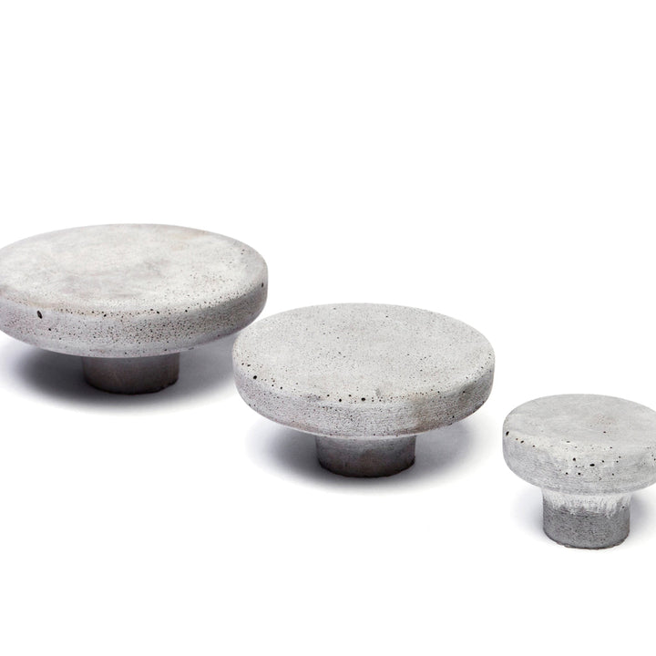 A group of three Urbi et Orbi Pomolo Knobs/Hooks sitting next to each other.