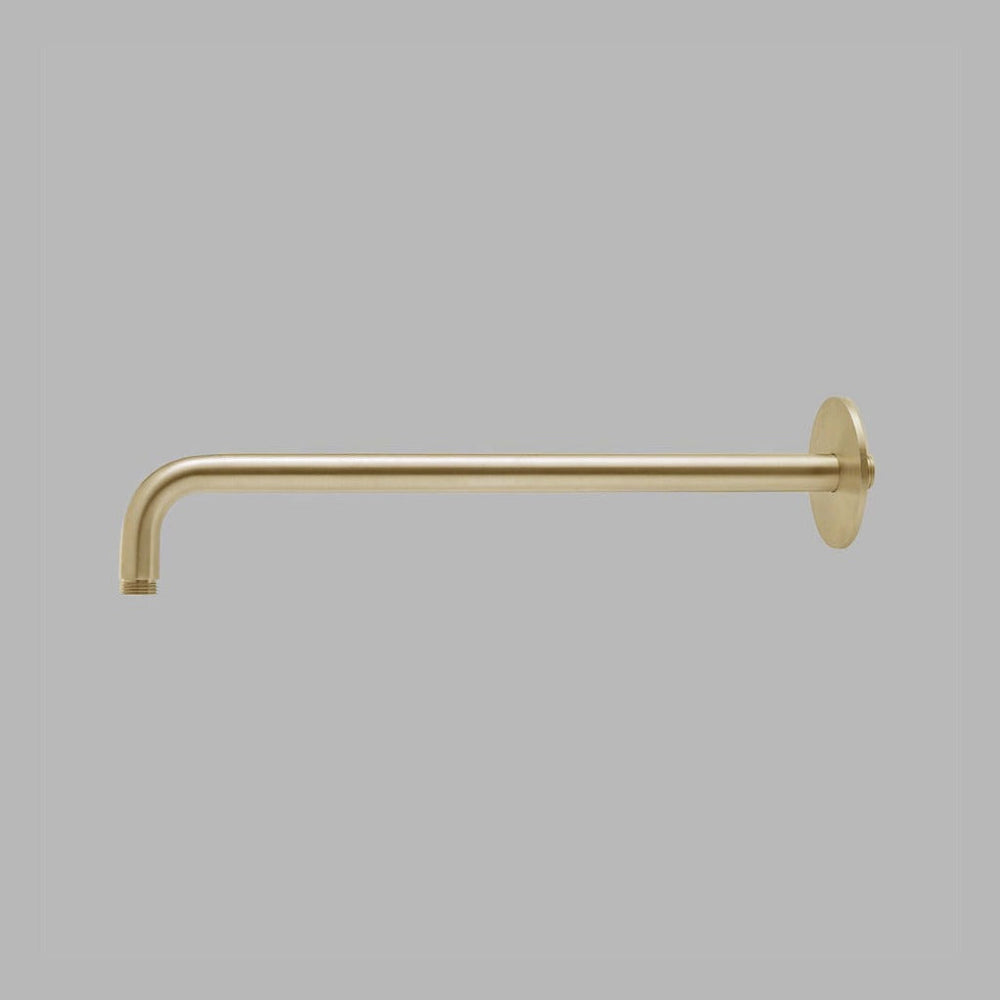 A dline arm for shower head in satin brass.