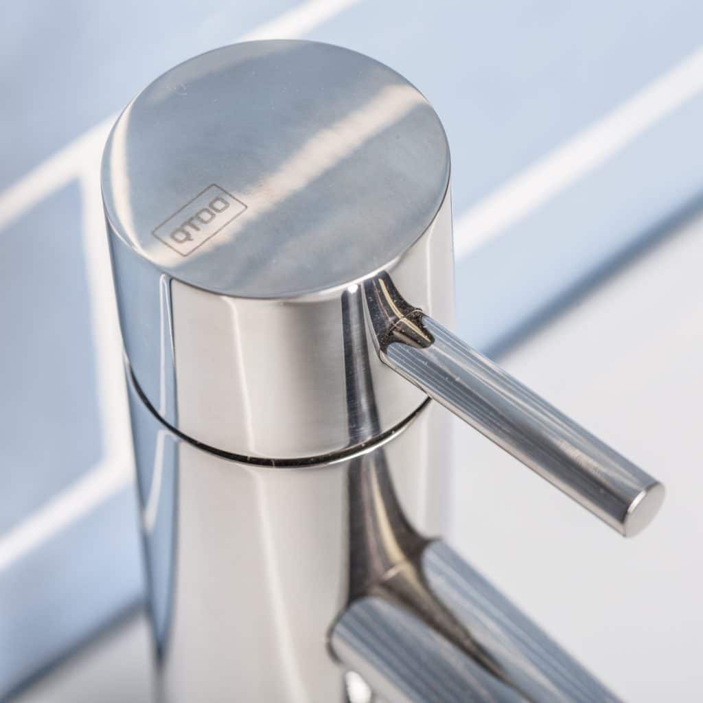 qtoo faucet by d line crafted from AISI 316 marine grade stainless steel shown here in polished stainless steel mounted in bathroom
