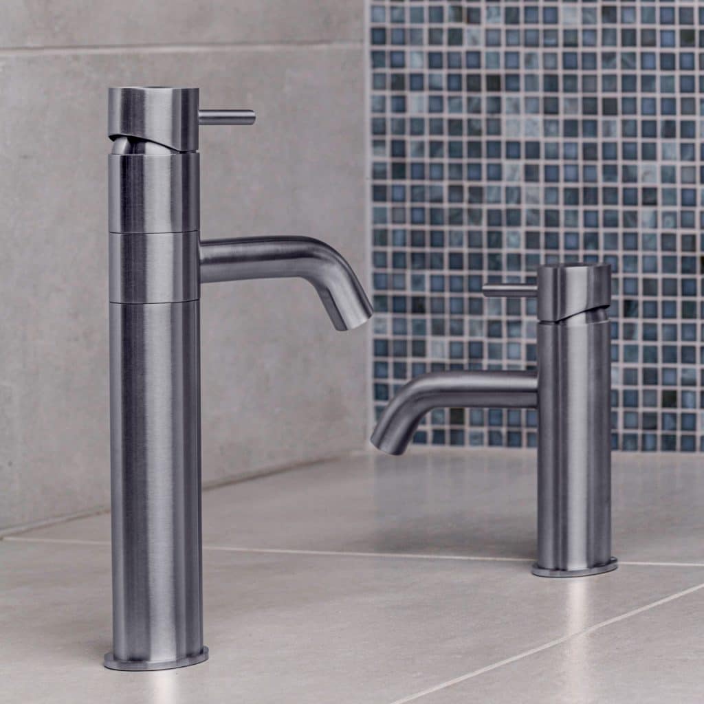 Qtoo Single Hole Tall Faucet QT1200 by d line crafted from AISI 316 marine grade stainless steel photographed on a tile backdrop