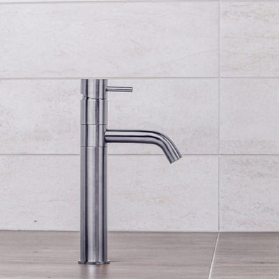 Qtoo Single Hole Tall Faucet QT1200 by d line crafted from AISI 316 marine grade stainless steel photographed on a tile backdrop