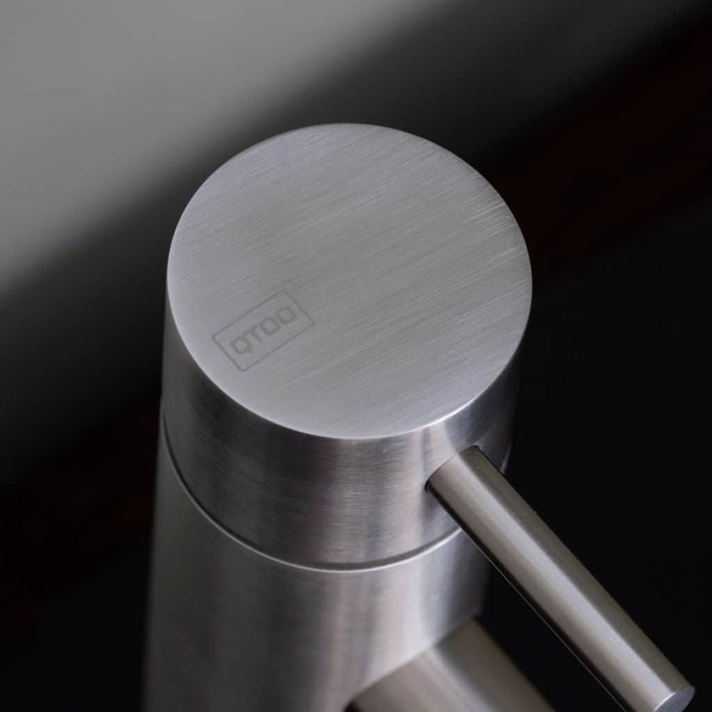 qtoo faucet by d line crafted from AISI 316 marine grade stainless steel shown here in satin stainless steel mounted in bathroom
