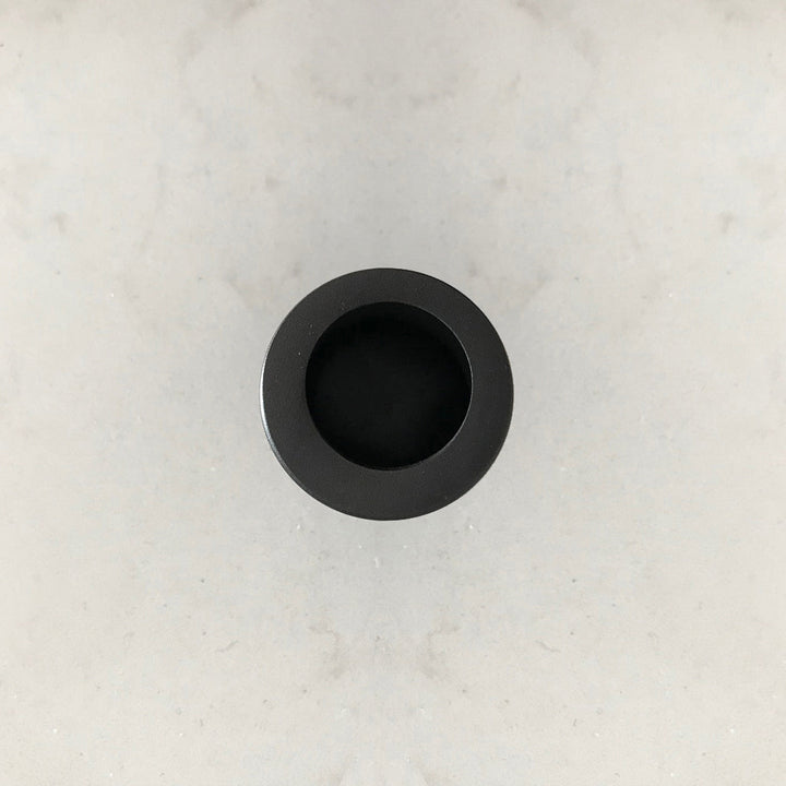 An AHI Round Edge Pull sitting on top of a white counter.