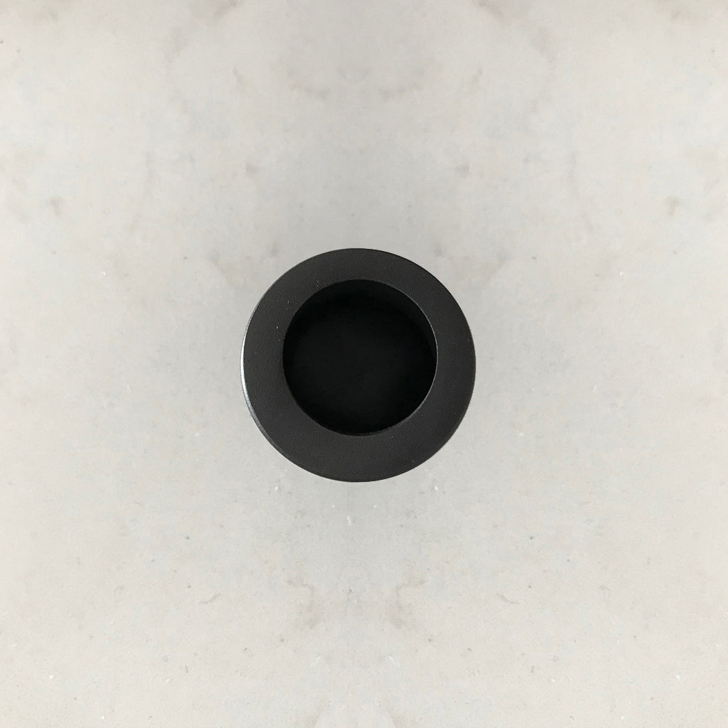 An AHI Round Edge Pull sitting on top of a white counter.