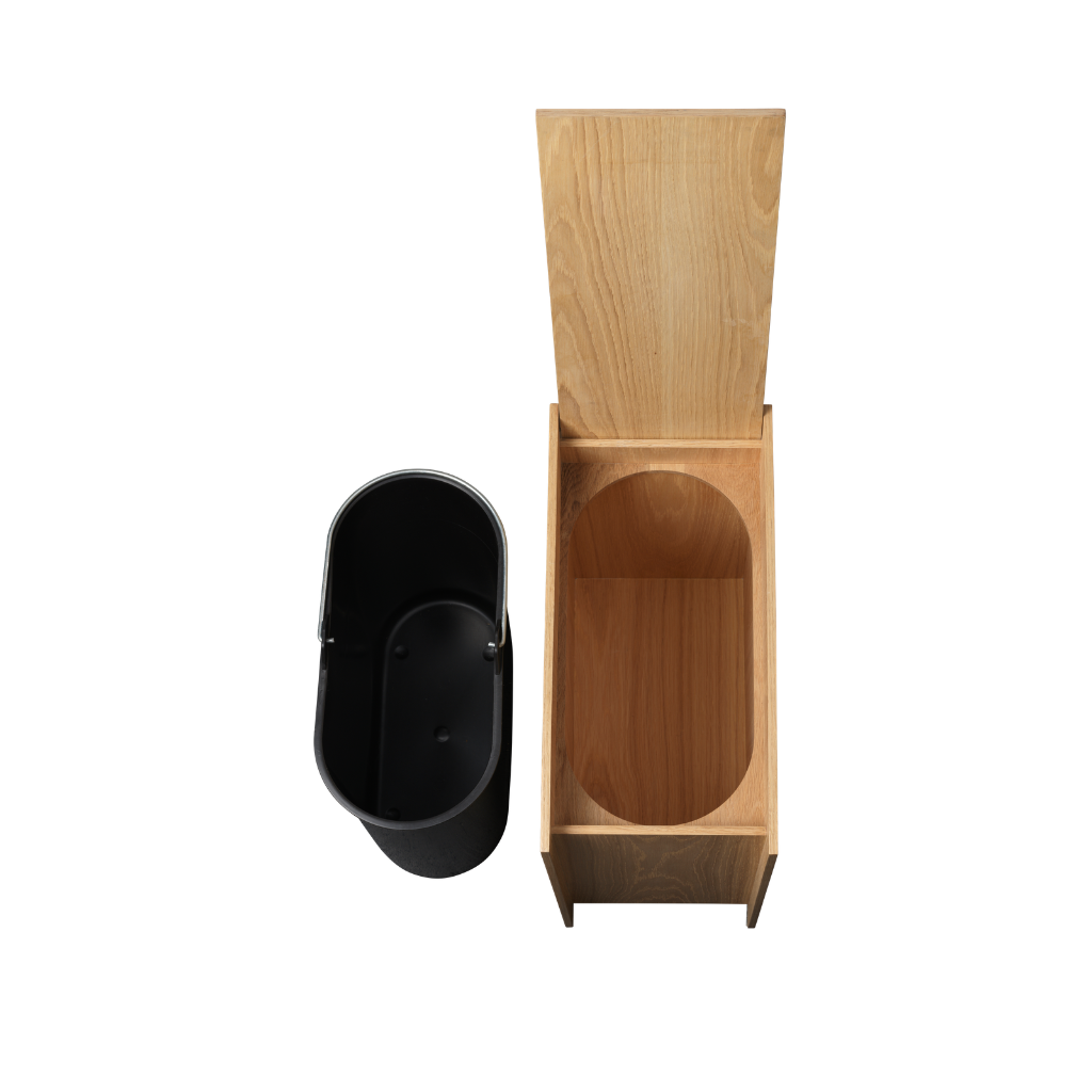 Ferm Living Sama wooden bin in oak veneer with a removable black plastic insert against a white background.