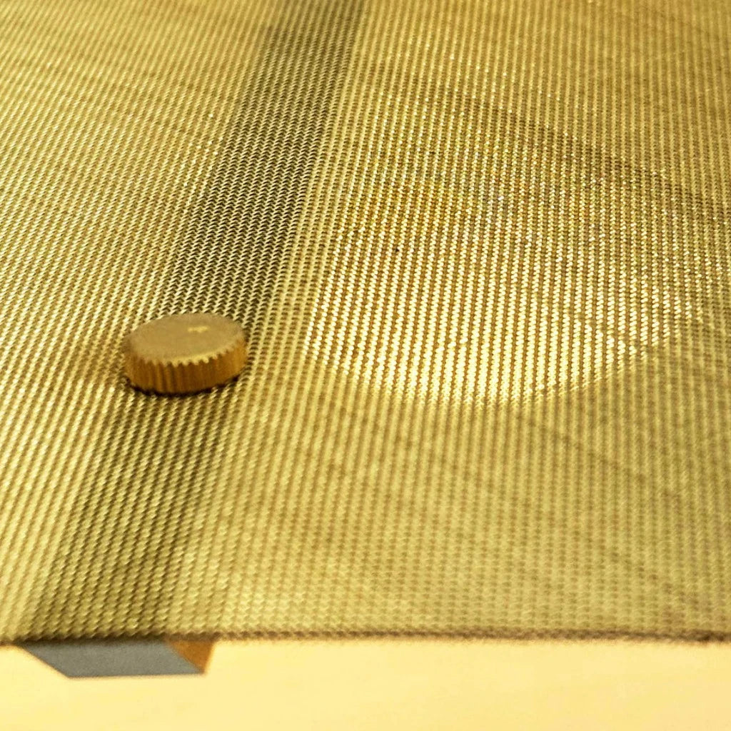 Close-up of Screen Light from Object Interface in Brass
