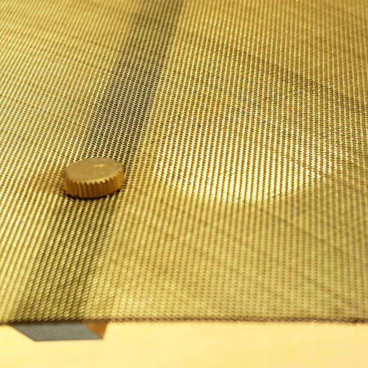 Close-up of Screen Light from Object Interface in Brass