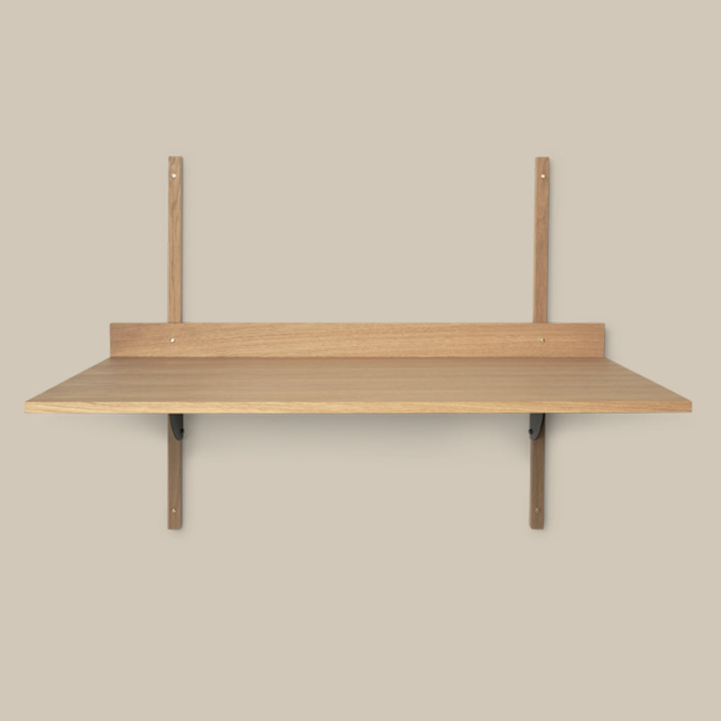 A Sector Desk by Ferm Living with two hooks on it.