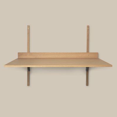 A Sector Desk by Ferm Living with two hooks on it.