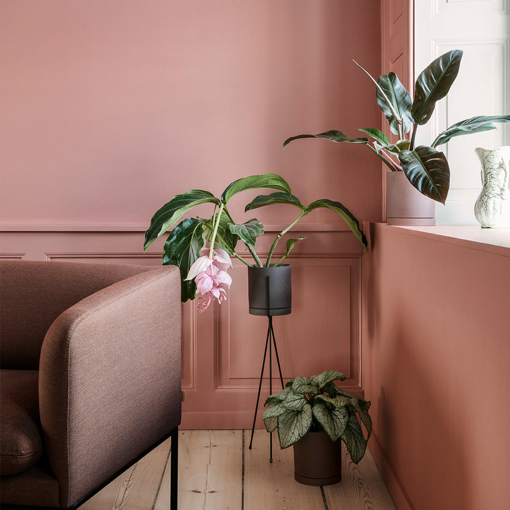 A Sekki Pot by Ferm Living sitting on top of a white table.