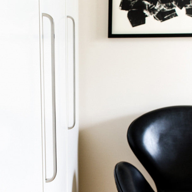 Long, slim and elegant handles on modern cabinet doors. Wardrobe closet handles.