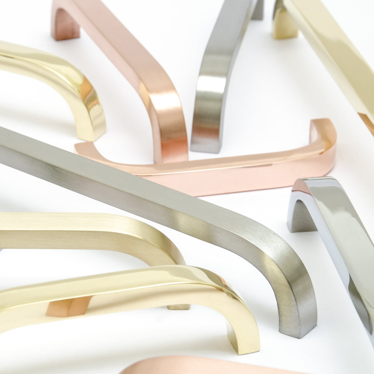 A group of Baccman Berglund Slim Pull handles in different colors on a white surface.