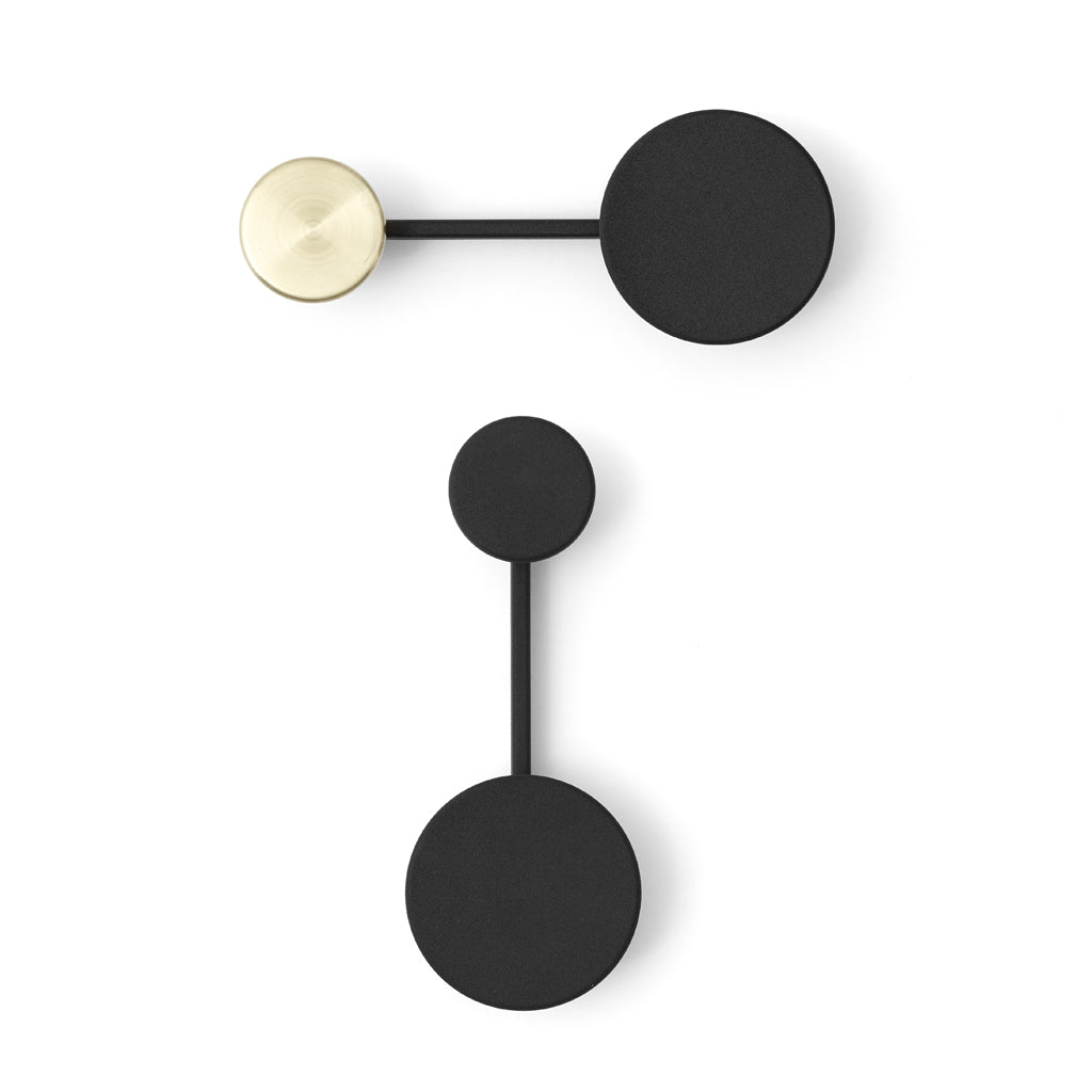 An Audo Small Afteroom Coat Hanger in black and gold is mounted on a white wall.