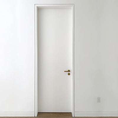 An open door in a white room with a wooden floor and a DesignMod Smoothline Flush Mount Wall Plate: Drywall Mount.