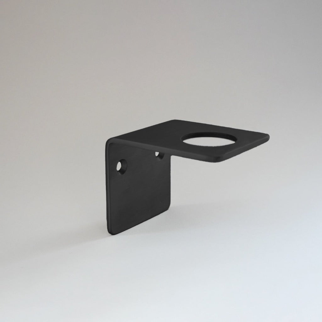 Powdercoated black stainless steel wall bracket of soap, cream and hand sanitizer.
