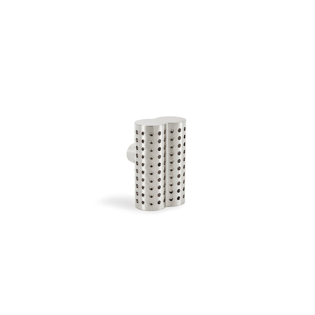 A close up of a Maison Vervloet Stardust Perforated Knob on a white background.