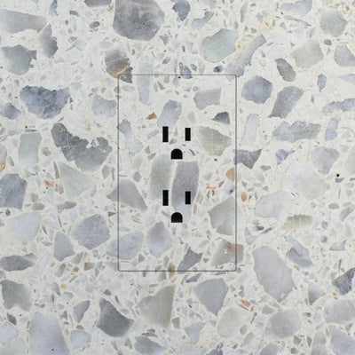 A Trufig Leviton Fascia Electrical Outlet on a marble wall.