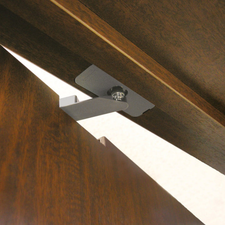 a close up of a ceiling fan on a wooden ceiling.