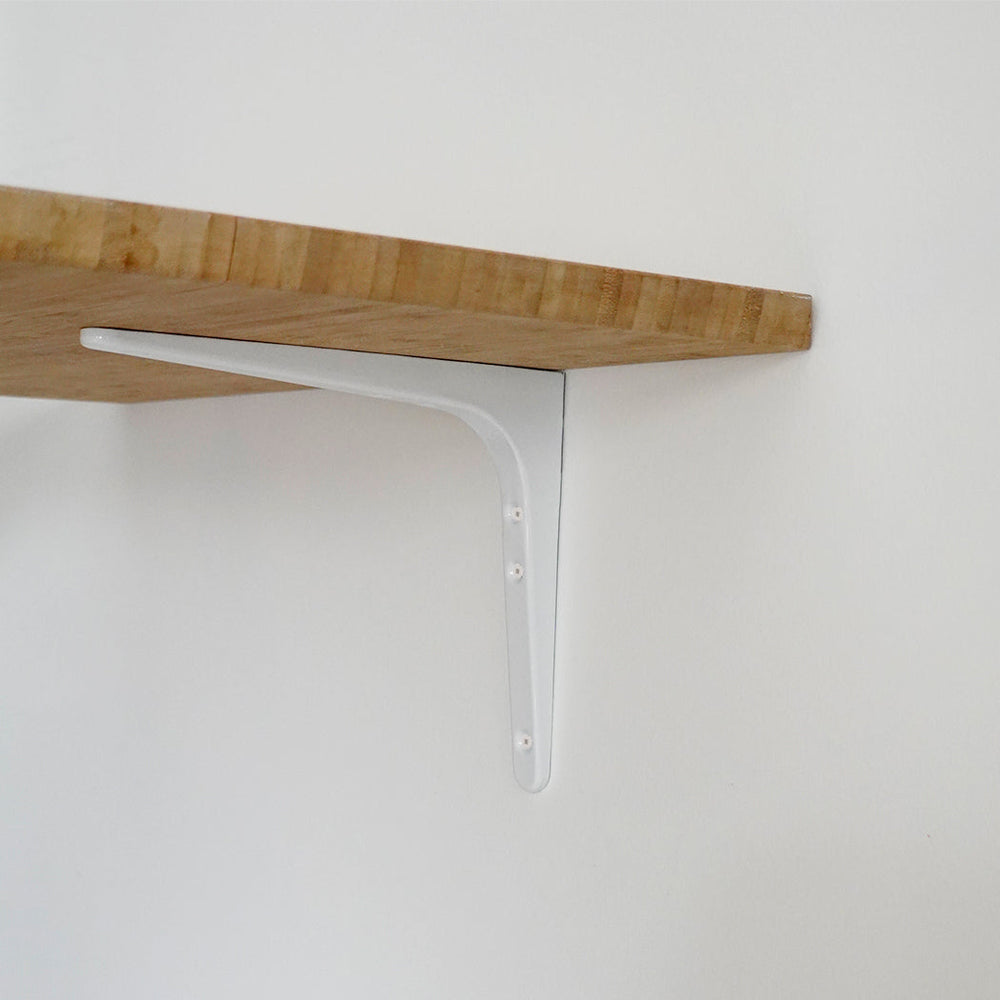 A Sugatsune shelf bracket with a wooden shelf on top of it.