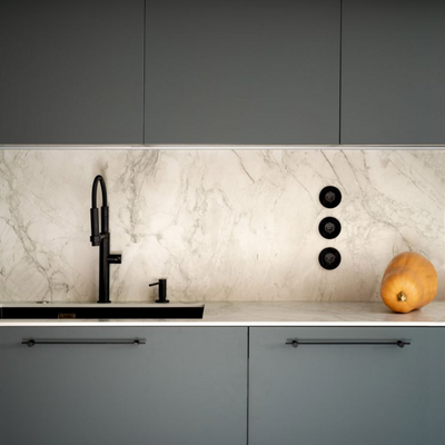 a kitchen counter with a Formani TENSE BB25 160/320 Cabinet Handle sink and faucet.