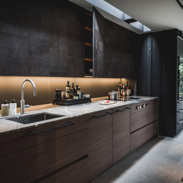 a kitchen with a Formani TENSE BB25 160/320 Cabinet Handle sink and counter top.