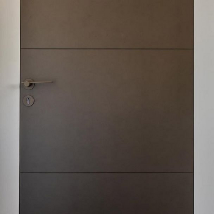 A Formani TENSE BBY53 Escutcheon door handle in a room.
