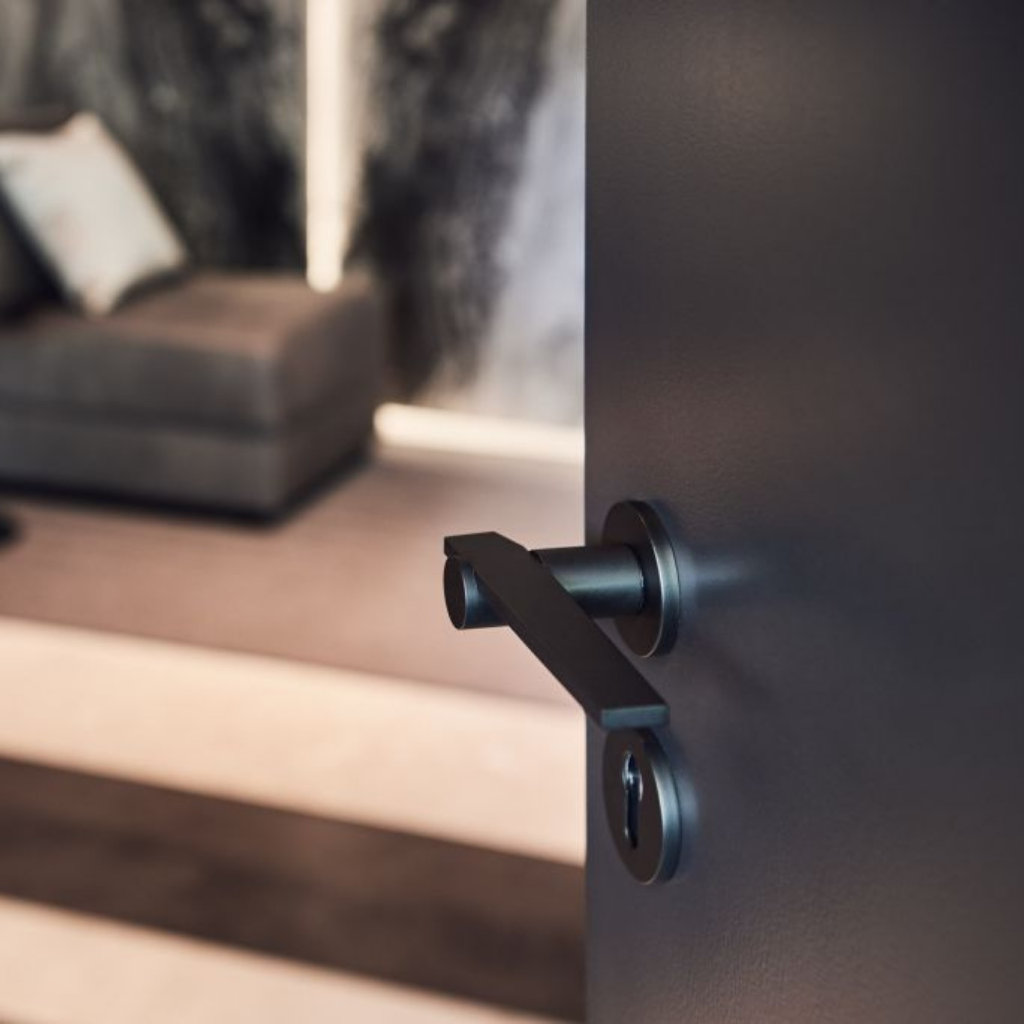 a close up of a Formani TENSE BBY53 Escutcheon on a door.