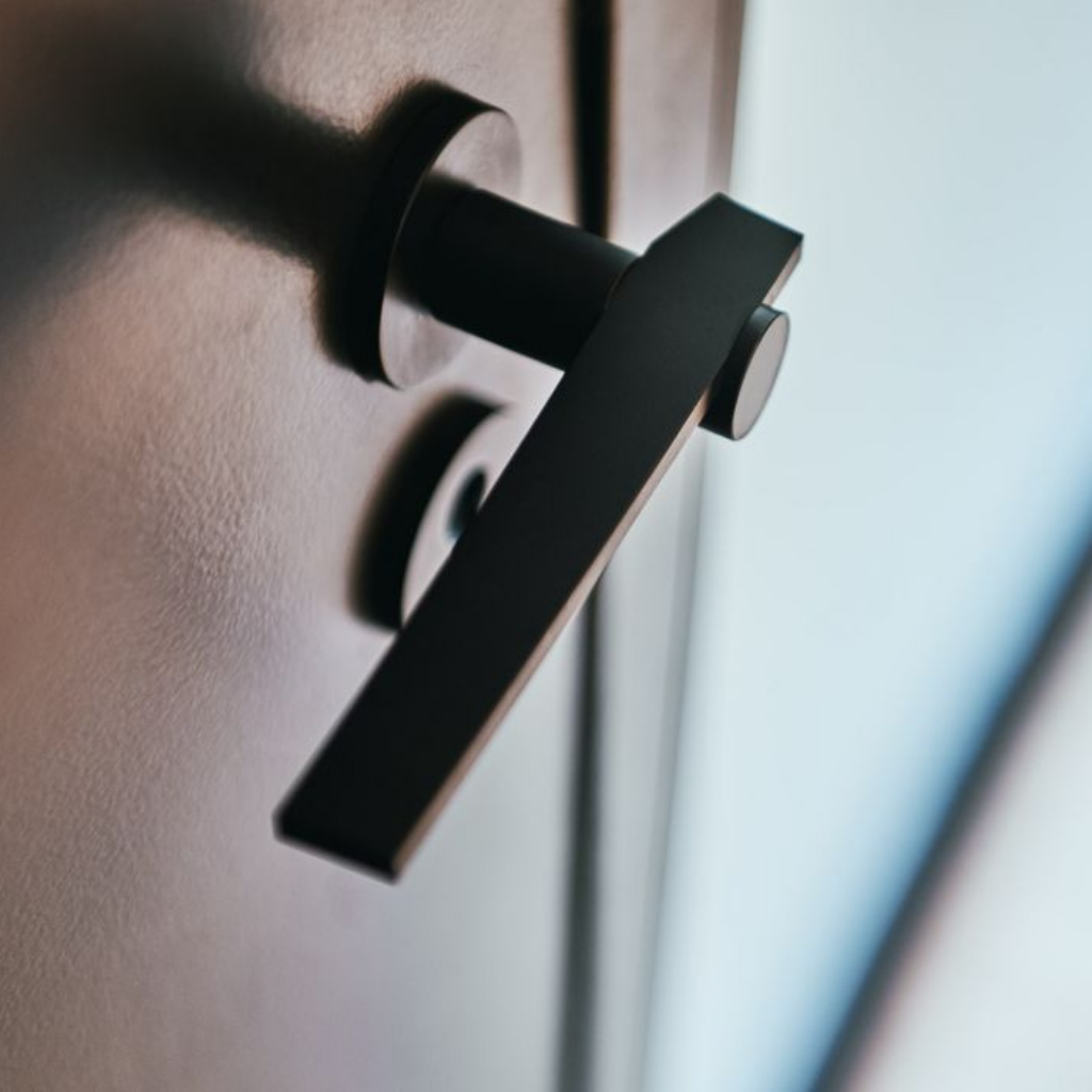 A close up of a Formani TENSE BBY53 Escutcheon on a door.