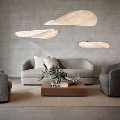 A living room filled with New Works' Tense Pendant Lamps and furniture.