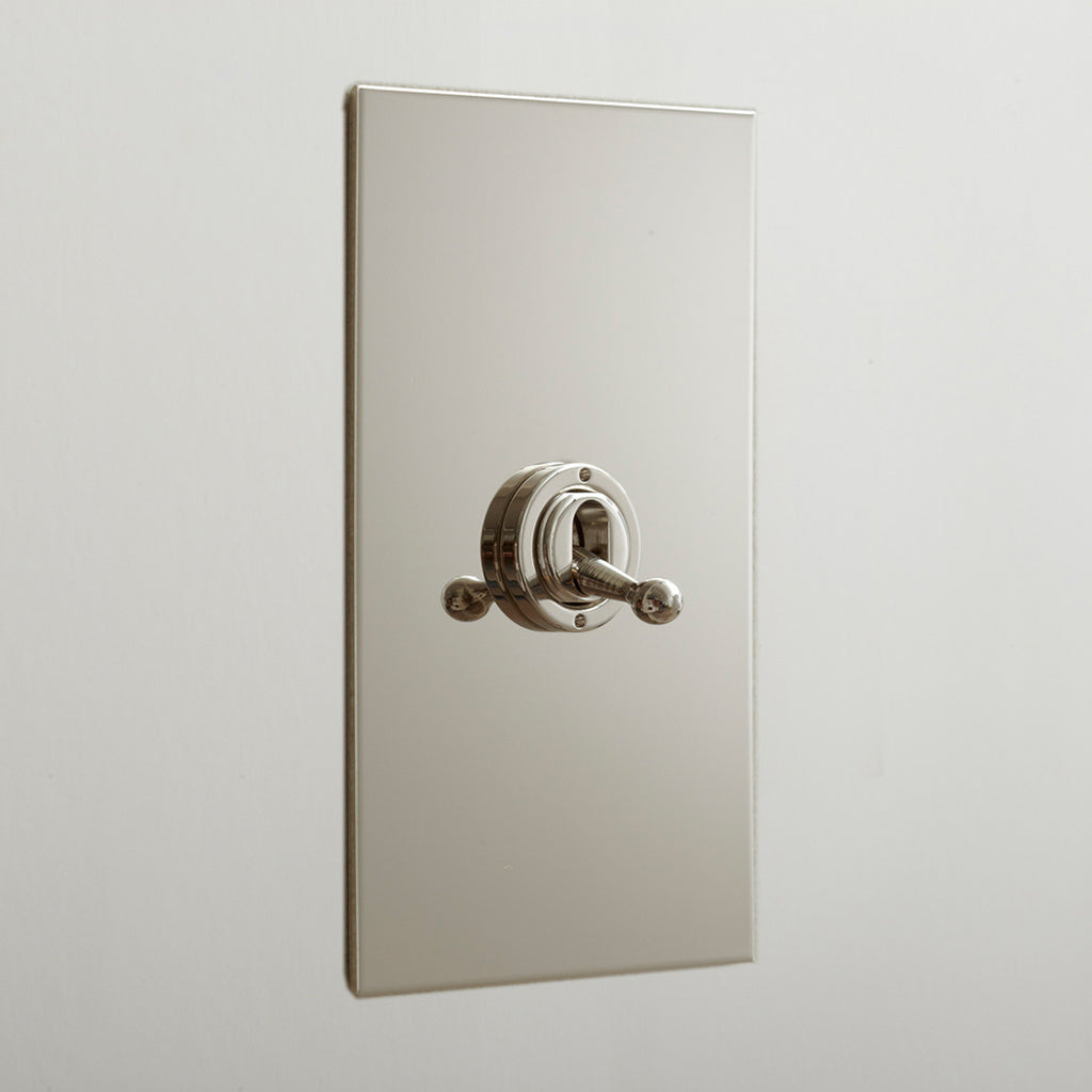 Forbes & Lomax toggle switch detail on a metal plate.
