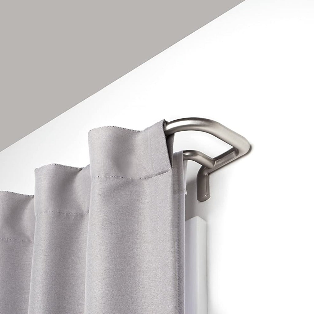 A close up of the Umbra Twilight Double Curtain Rod in a room.