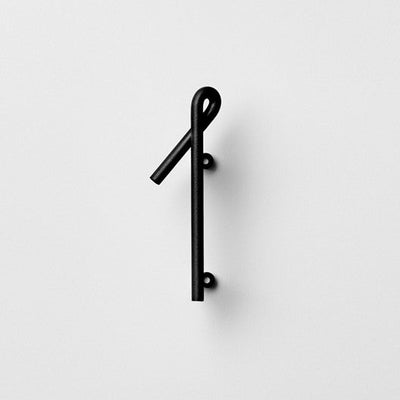 Black house number in cool font made by bent steel.