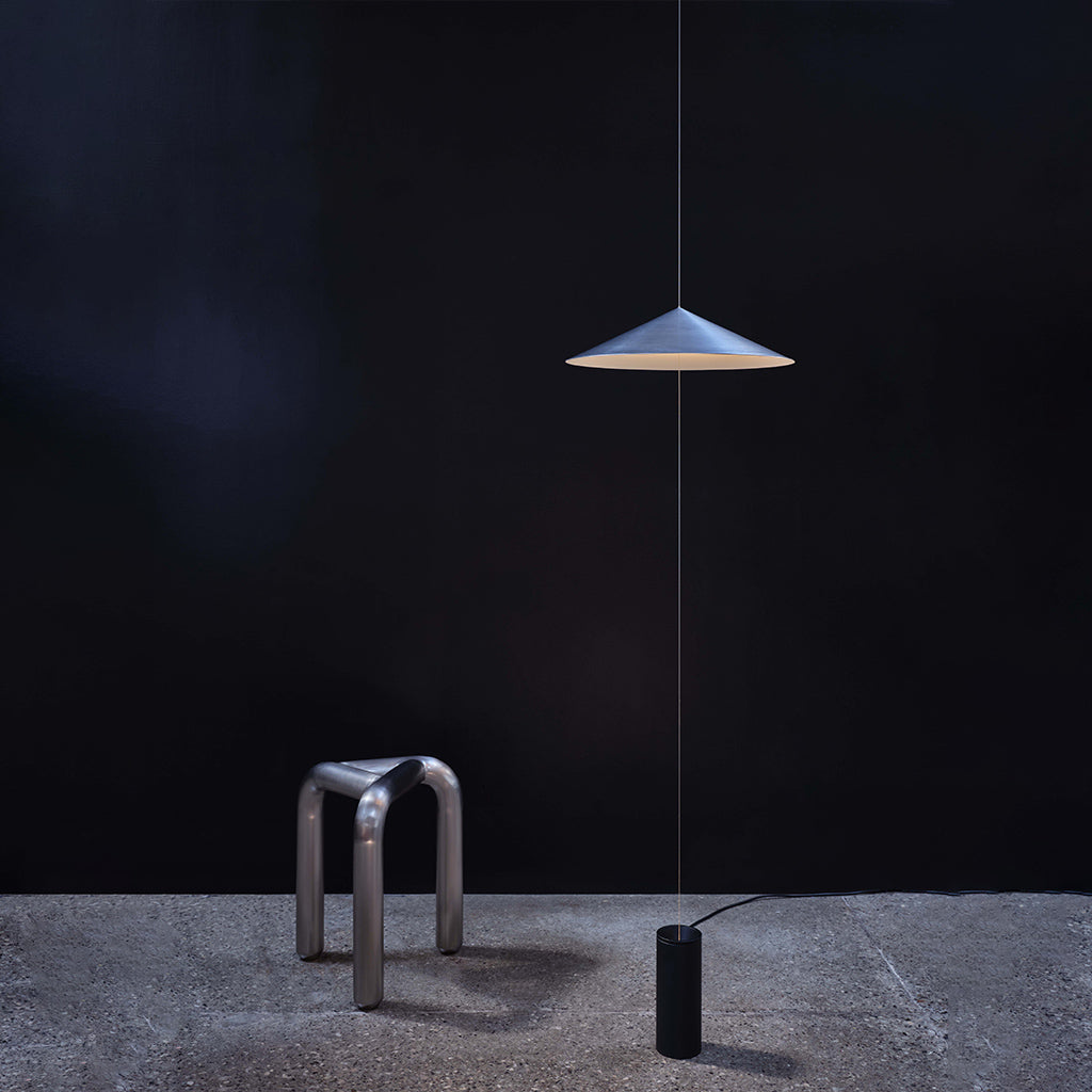 Wisp Suspension Light installed in a minimalist space