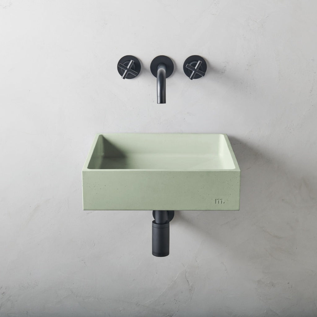 A mudd. concrete Yarra Basin LG Affix with two faucets and a soap dispenser.