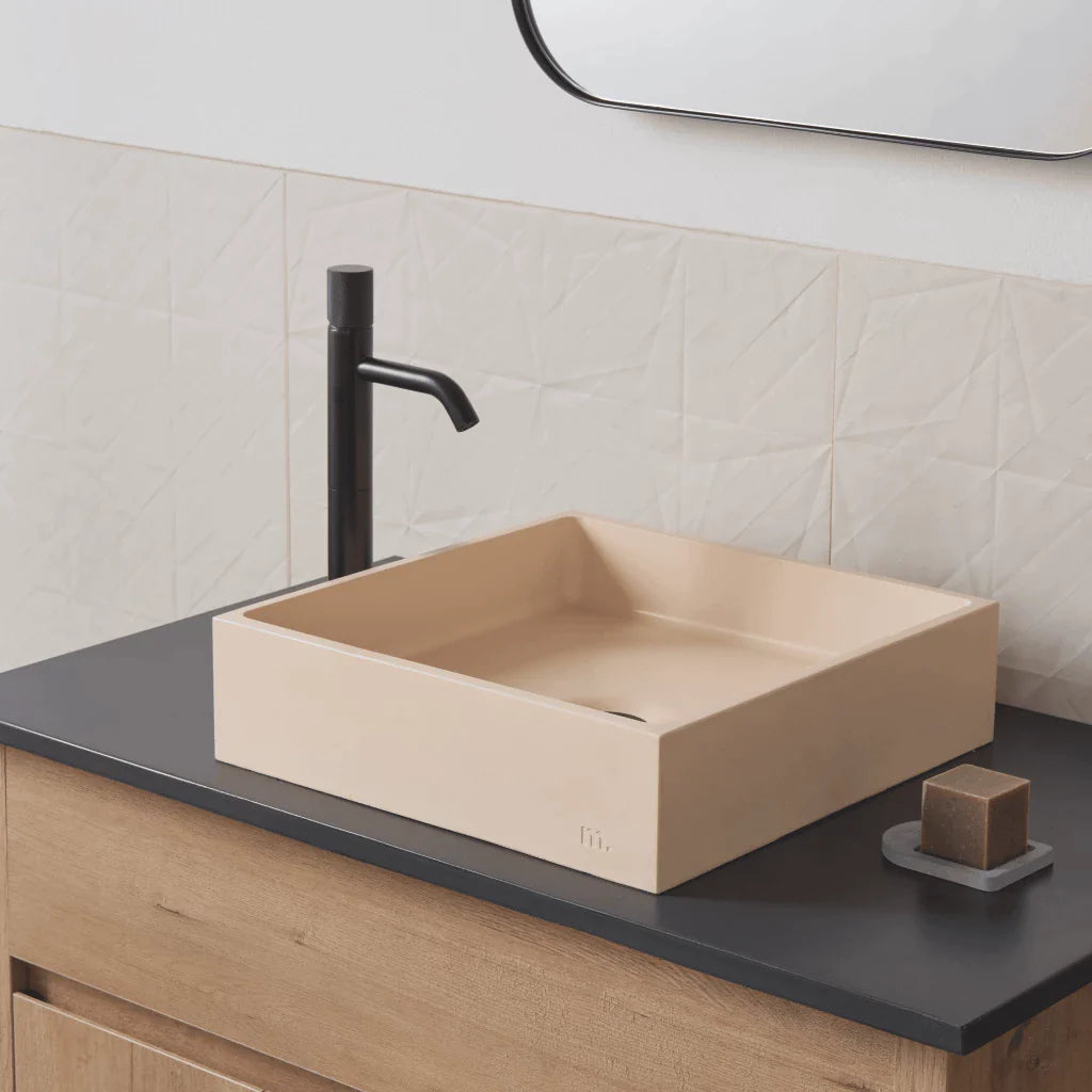 Square wash basin with cream finish mounted on vanity