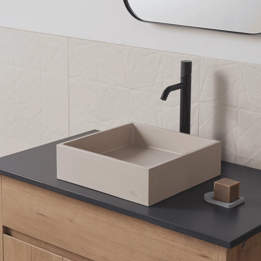Square wash basin with pale beige finish mounted on vanity