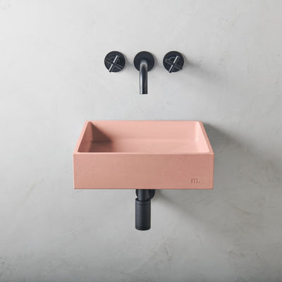 A mudd. concrete Yarra Basin LG Affix with a black faucet and a pink sink.