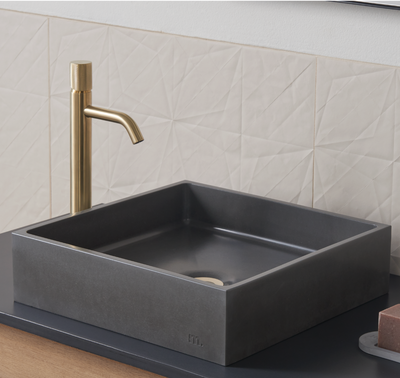 A mudd. concrete Yarra Basin LG bathroom sink with a faucet and soap dispenser.