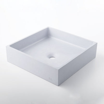 A white Yarra Basin LG square shaped sink on a mudd. concrete white surface.