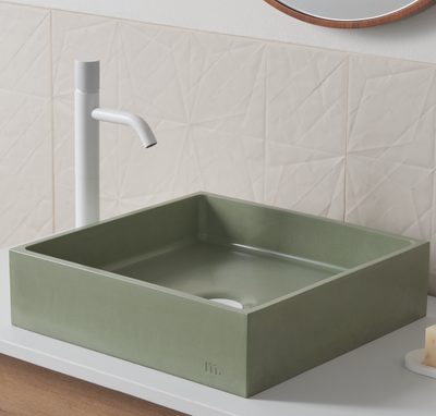 A Yarra Basin LG sink with a faucet and soap dispenser by mudd. concrete.