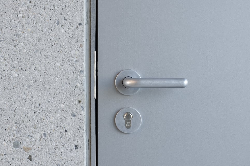 FSB 1244 lever on a perforated metal door at the Hyparschale in Magdeburg