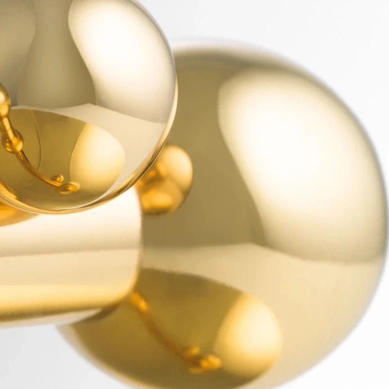 Close-up of the polished brass Vervloet Bubbles lever by India Mahdavi.