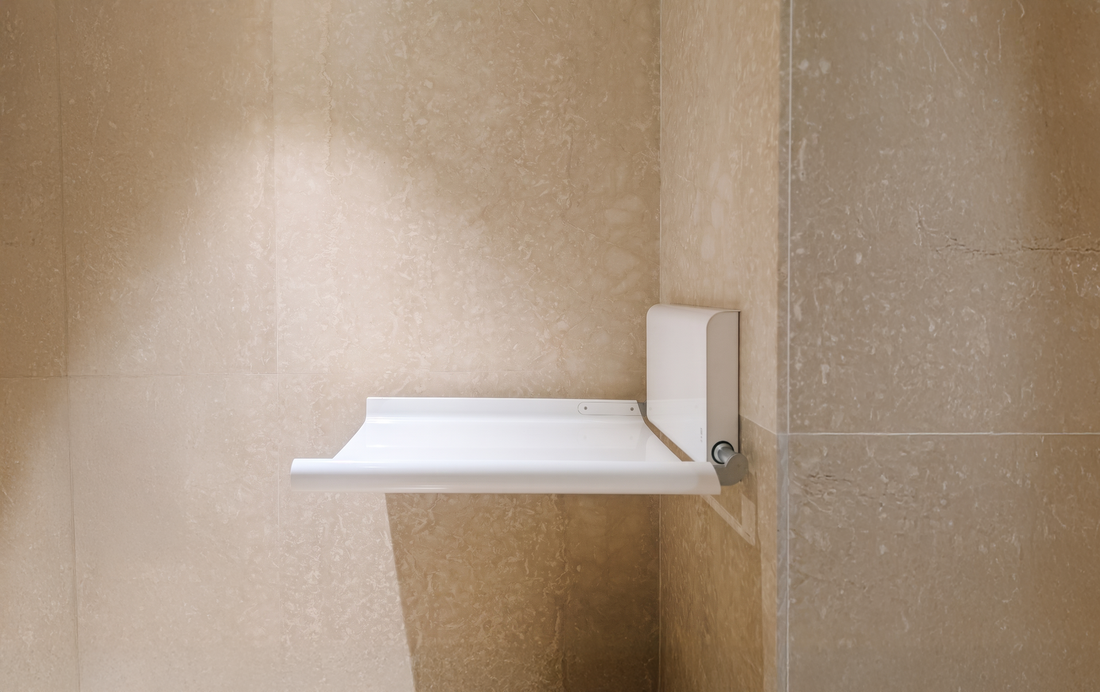BJÖRK hand dryer mounted in a minimal washroom, Red Dot–awarded form